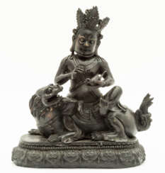 SINO-TIBETAN BRONZE FIGURE SHOWING A DEITY WITH A RAT RIDING ON A MYTHICAL CREATURE