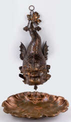 A CHINESE COPPER WATER DISPENSER IN FORM OF A FISH AND A BASSIN PROBABLY FROM THE YUANMING YUAN, THE OLD SUMMER PALACE