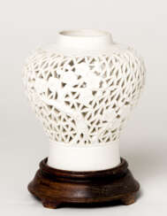 A CHINESE WHITE PORCELAIN OPEN-WORKED MEIPING VASE WITH FLORAL DECOR