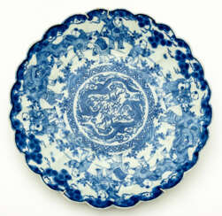 VERY LARGE CHINESE BLUE AND WHITE PORCELAIN PLATE WITH FIGURAL SCENES AND MYTHICAL CREATURES
