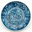 CHINESE BLUE AND WHITE PORCELAIN PLATE SHOWING A DRAGON - Auction Items