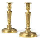 A PAIR OF LOUIS XVI ORMOLU CANDLESTICKS - photo 1