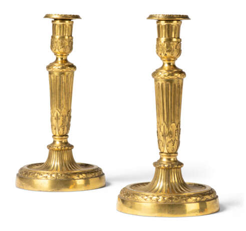 A PAIR OF LOUIS XVI ORMOLU CANDLESTICKS - photo 1