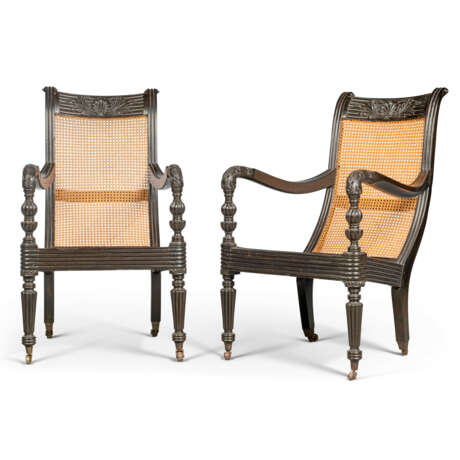 A PAIR OF ANGLO-INDIAN EBONY AND CANED ARMCHAIRS - photo 1