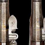 Ein Paar eisengeschnittene Steinschlosspistolen von Caspar Schultz deutsch um 1720. - фото 4