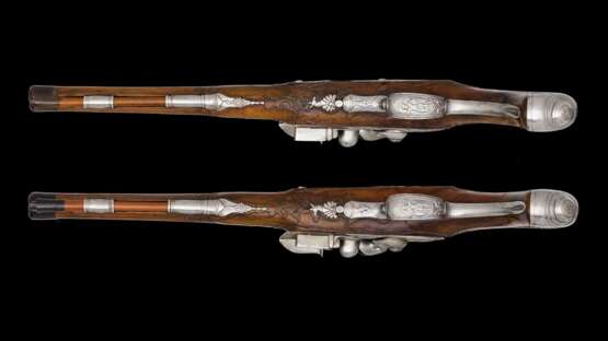 Ein Paar eisengeschnittene Steinschlosspistolen von Caspar Schultz deutsch um 1720. - Foto 7
