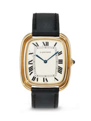 CARTIER. A RARE, LARGE, AND ATTRACTIVE 18K GOLD CUSHION-SHAPED WRISTWATCH WITH STEPPED CASE