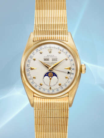 ROLEX. AN EXCEEDINGLY RARE AND SUPERBLY PRESERVED 18K GOLD AUTOMATIC TRIPLE CALENDAR WRISTWATCH WITH MOON PHASES, LUMINOUS STAR HOUR MARKERS AND BRACELET - photo 8