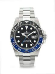 ROLEX. A COVETED STAINLESS STEEL AUTOMATIC DUAL TIME WRISTWATCH WITH SWEEP CENTER SECONDS, DATE, AND BRACELET