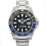 ROLEX. A COVETED STAINLESS STEEL AUTOMATIC DUAL TIME WRISTWATCH WITH SWEEP CENTER SECONDS, DATE, AND BRACELET - photo 1