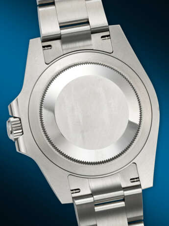 ROLEX. A COVETED STAINLESS STEEL AUTOMATIC DUAL TIME WRISTWATCH WITH SWEEP CENTER SECONDS, DATE, AND BRACELET - Foto 4