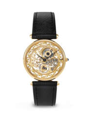 PATEK PHILIPPE. A RARE AND STUNNINGLY ATTRACTIVE 18K GOLD SKELETONIZED WRISTWATCH WITH HAND-ENGRAVED MOVEMENT