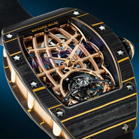 RICHARD MILLE. AN EXCEPTIONAL AND HIGHLY ATTRACTIVE GOLD CARBON TPT&#174;, 18K RED, YELLOW GOLD, AND TITANIUM ULTRA-SKELETONIZED AUTOMATIC TOURBILLON WRISTWATCH - photo 5