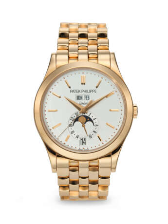 PATEK PHILIPPE. A RARE AND ATTRACTIVE 18K PINK GOLD AUTOMATIC ANNUAL CALENDAR WRISTWATCH WITH SWEEP CENTER SECONDS, MOON PHASES, 24-HOUR INDICATION, AND BRACELET - фото 1