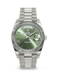 ROLEX. AN ATTRACTIVE AND COVETED 18K WHITE GOLD AUTOMATIC WRISTWATCH WITH SWEEP CENTER SECONDS, DAY, DATE AND BRACELET