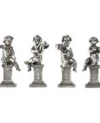 Silver 800. Four funny figures of putti musicians in silver. 