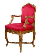 Textile. Magnificent, carved chair in the Rococo style of the 19th-20th centuries. 