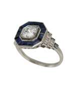 Product catalog. Elegant platinum ring with diamonds and sapphires. 