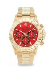 ASPREY, AN EXTREMELY ATTRACTIVE AND UNIQUE YELLOW GOLD 'DAYTONA', WITH RED DIAL, REF. 16528, NO. 1/1