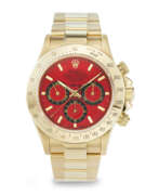 Yellow gold. ASPREY, AN EXTREMELY ATTRACTIVE AND UNIQUE YELLOW GOLD 'DAYTONA', WITH RED DIAL, REF. 16528, NO. 1/1