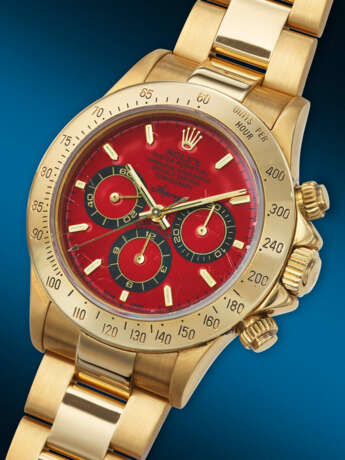 ASPREY, AN EXTREMELY ATTRACTIVE AND UNIQUE YELLOW GOLD 'DAYTONA', WITH RED DIAL, REF. 16528, NO. 1/1 - photo 2