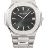 PATEK PHILIPPE, VERY RARE AND EARLY STAINLESS STEEL 'NAUTILUS', REF. 3700/1 - photo 1