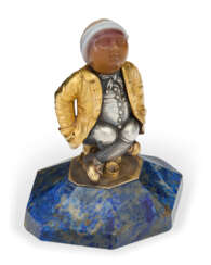 A CONTINENTAL GOLD, SILVER, SILVER-GILT, AGATE, AND LAPIS LAZULI FIGURE OF A YOUTH
