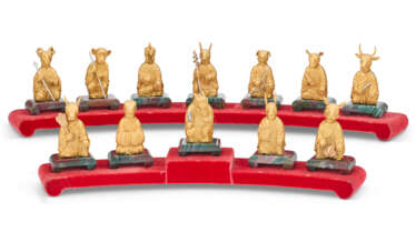 A SET OF TWELVE GOLD AND BLOODSTONE ZODIAC FIGURES