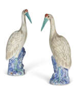Toys and Models. A PAIR OF CHINESE EXPORT PORCELAIN FAMILLE ROSE MODELS OF CRANES