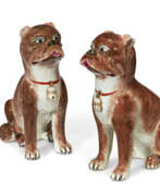 Jouets et Modèles. A PAIR OF CHINESE EXPORT PORCELAIN FAMILLE ROSE MODELS OF PUGS