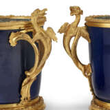 A NEAR PAIR OF REGENCE ORMOLU-MOUNTED CHINESE POWDER-BLUE PORCELAIN CACHE POTS - photo 5