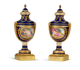A PAIR OF ORMOLU-MOUNTED SEVRES PORCELAIN 'BLEU NOUVEAU' VASES (VASES CHAPELET) AND TWO COVERS