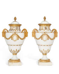 A PAIR OF ORMOLU AND MARBLE MOUNTED PARIS (COMTE D'ARTOIS) PORCELAIN GILT-WHITE VASES AND TWO COVERS