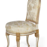A NEAR PAIR OF LOUIS XVI WHITE-PAINTED AND PARCEL-GILT CHAISES - photo 2