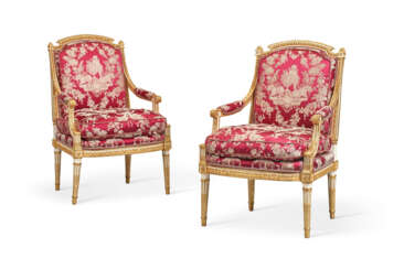A PAIR OF LOUIS XVI WHITE-PAINTED AND PARCEL-GILT WALNUT FAUTEUILS