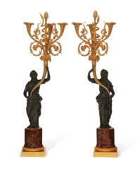 A PAIR OF FRENCH ORMOLU AND PATINATED BRONZE THREE-LIGHT CANDELABRA