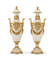 A PAIR OF FRENCH ORMOLU-MOUNTED WHITE MARBLE TWIN-HANDLED URNS