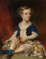 Portrait of a boy with a puppet doll