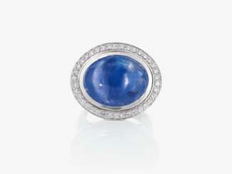 A ring with a sapphire and brilliant-cut diamonds