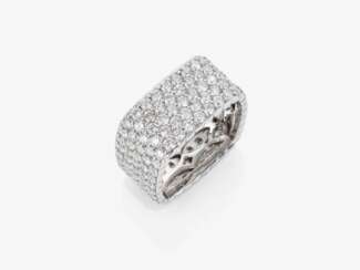 A modern band ring decorated with brilliant-cut diamonds