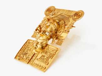 A pendant/brooch depicting a Mexican deity