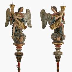 A pair of angels with candlesticks