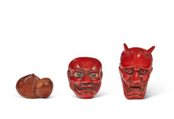 A GROUP OF TWO RED-LACQUER NETSUKE AND A BOXWOOD NETSUKE