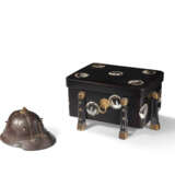 A PARCEL RED-AND-GILT-LACQUERED IRON MINIATURE HELMET AND A MOTHER-OF-PEARL-INLAID BLACK LACQUER BOX AND COVER - photo 1