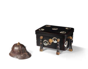 A PARCEL RED-AND-GILT-LACQUERED IRON MINIATURE HELMET AND A MOTHER-OF-PEARL-INLAID BLACK LACQUER BOX AND COVER