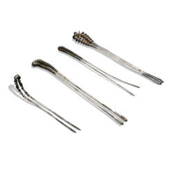 A GROUP OF FOUR SILVER HAIRPINS