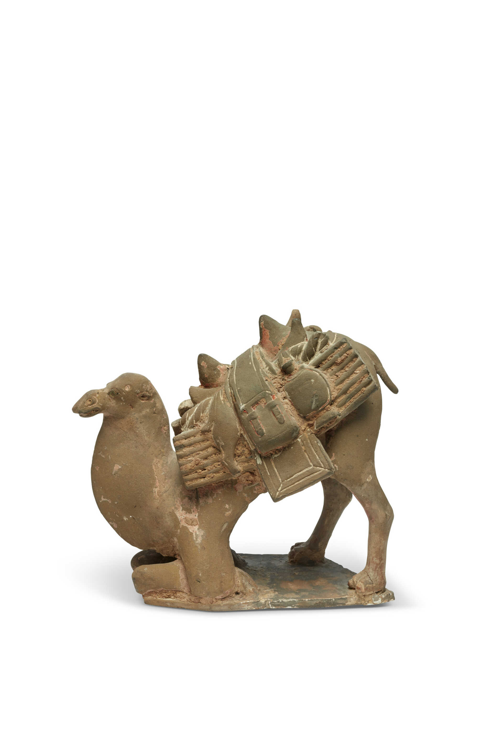A PAINTED POTTERY FIGURE OF A KNEELING CAMEL