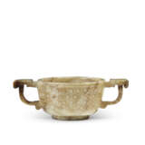 A SMALL CELADON JADE TWIN-HANDLED CUP - photo 1