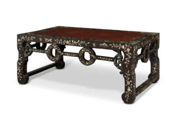 A MOTHER-OF-PEARL-INLAID LACQUERED WOOD AND LACQUER TABLE