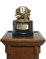 A brass telegraphic stock ticker
